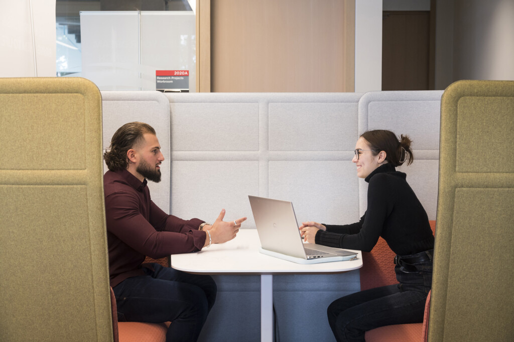 Sprott School of Business undergraduate students working together in a pod in Carleton University's Innovation Hub.