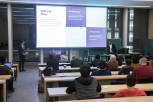 Male student entrepreneur presenting at the Carleton Innovation Hub Pitch Night.