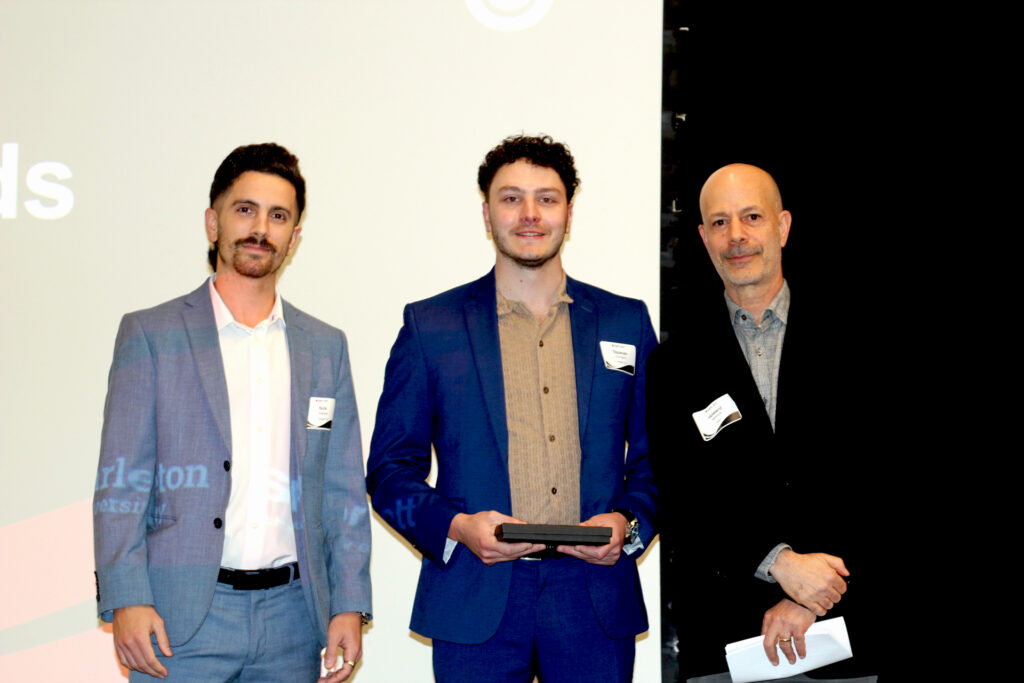 Sprott dean Howard Nemiroff presents representatives of Lekadir LLP with the Sprott Industry Partner Impact Award.