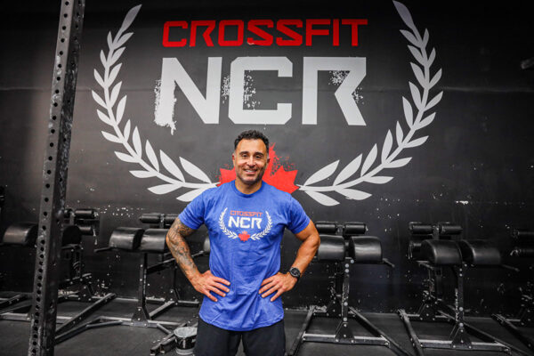 Sprott School of Business MBA graduate Reza Mashkoori and co-owner of NCR CrossFit in his gym.