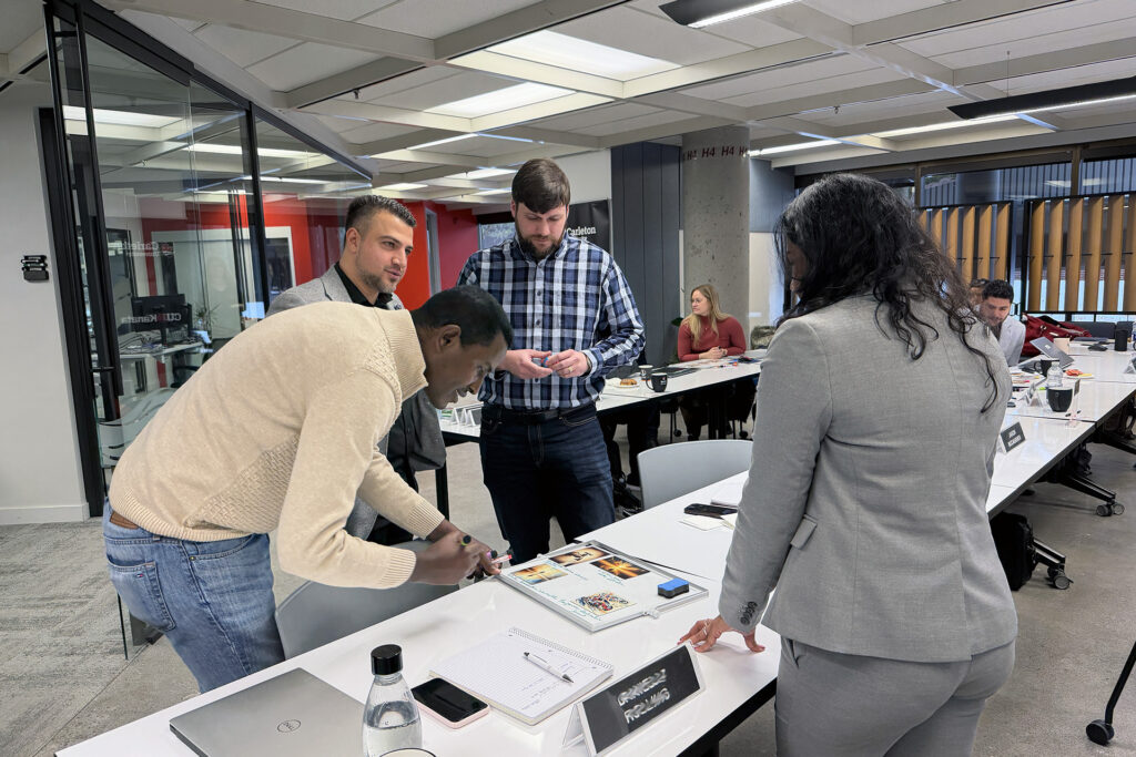 Students in Sprott's professional MBA in Kanata collaborating on a group project.