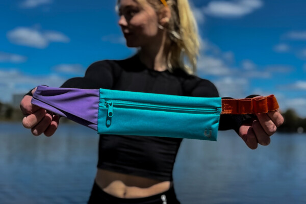 Bachelor of Commerce grad Sydney Neilsen with her KRuZ Running belt.
