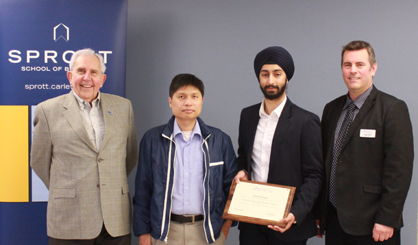 Representatives from APICS present Student Chapter plaque to supply chain management student Gurjot Sahni and Sprott professor Alan Cai.