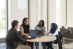 Accounting students meeting with Professor Rebecca Renfroe at Carleton University's Sprott School of Business in Ottawa, Canada.