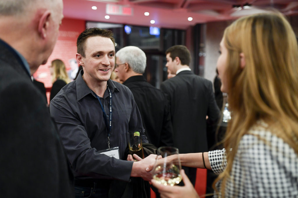 Ben Ryan shaking hands with a student