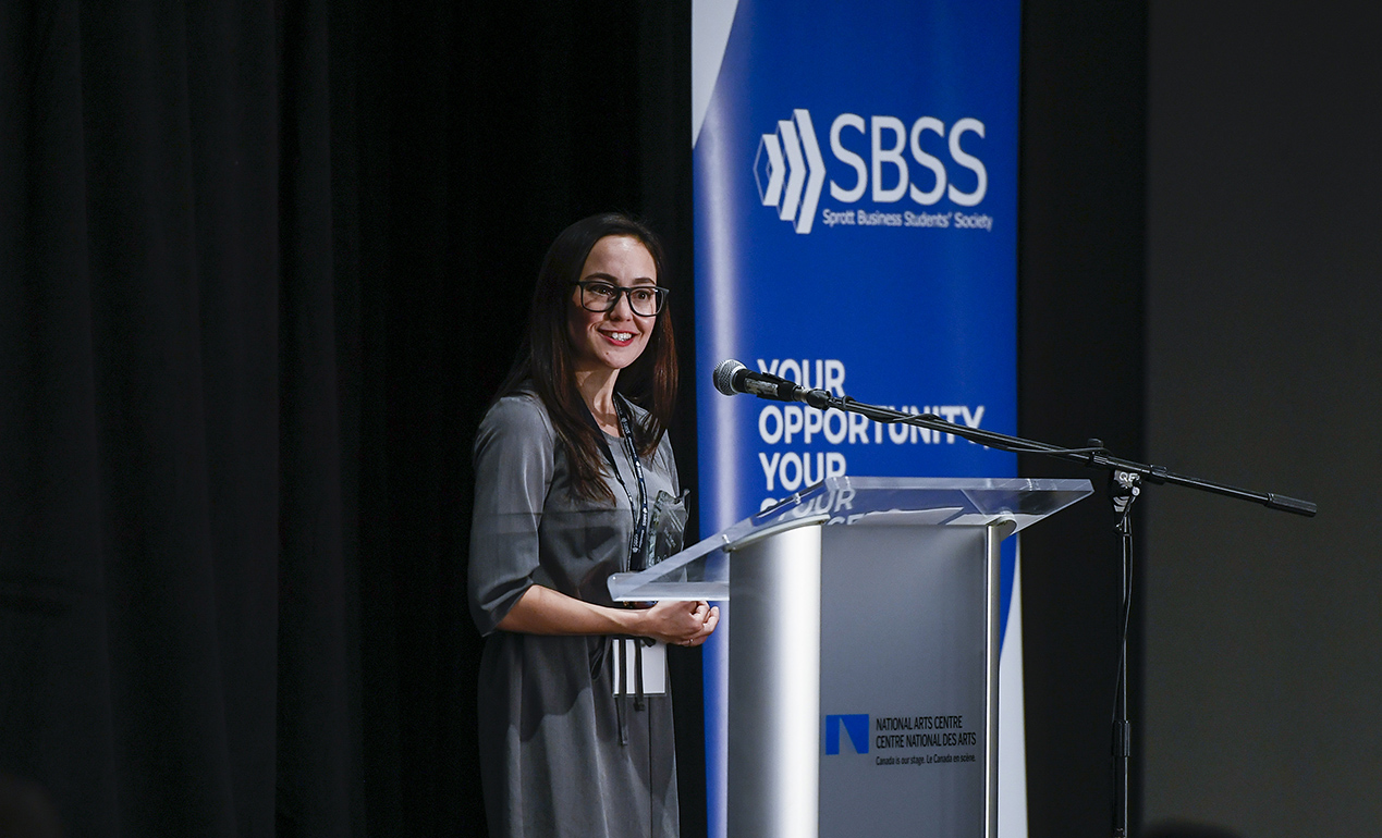 Jane at the podium accepting her Sprott Alumni Award