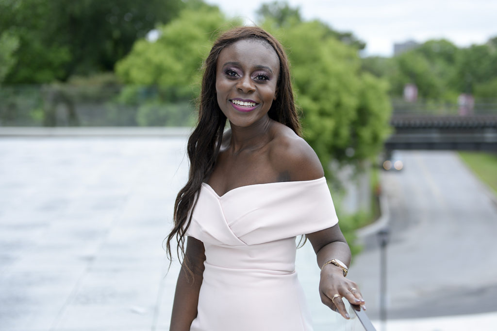 Chongo Bwalya holding on to the railing on the patio