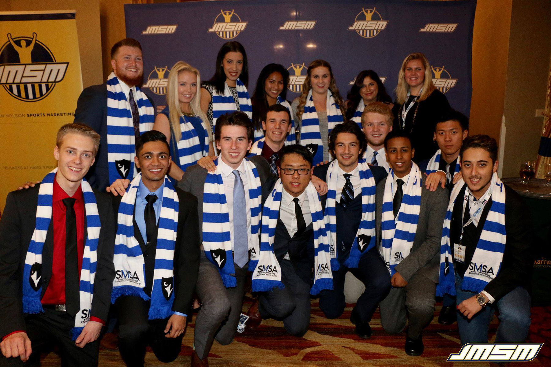 a team photo at JMUCC with their team scarves