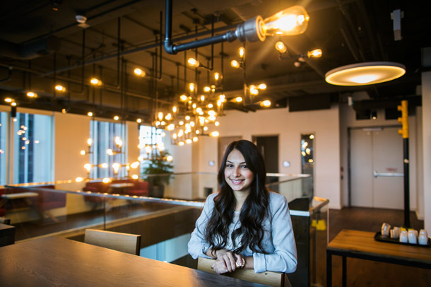 BCom alum Konval Matin in a common space at Shopify.