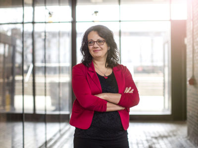 Luciara Nardon, associate professor on international business at the Sprott School of Business, standing in front of a window at Carleton University.