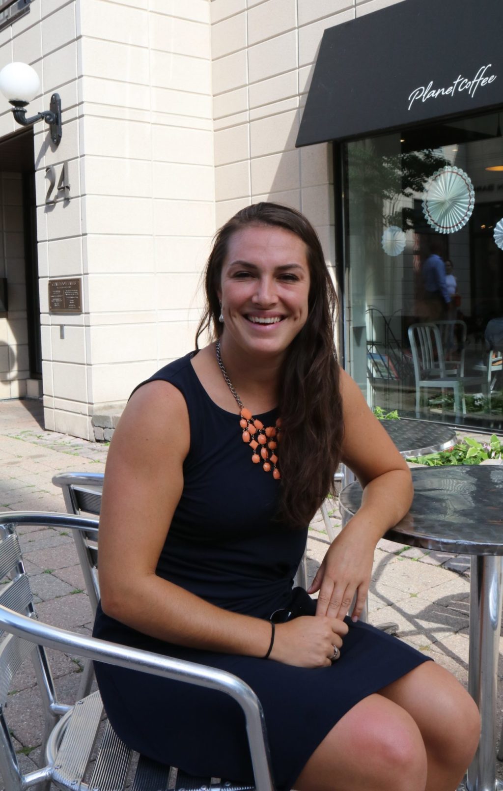 Sprott alumnus Melanie Judges sitting outside