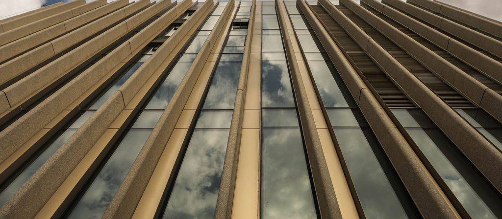 photo of Nicoll Building exterior and close-up on the windows and system of concrete fins.