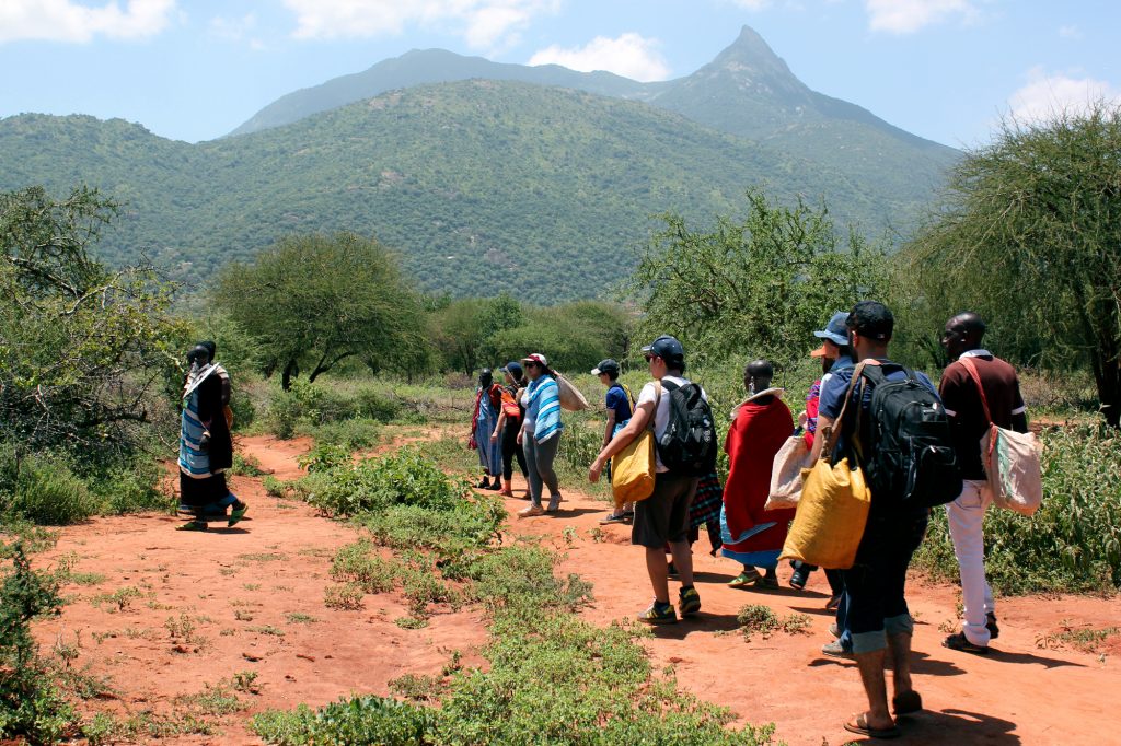 Sprott Students walking with people of Longido, Tanzania