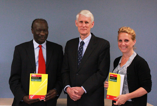 Professor Moses Kiggundu, Dean Jerry Tomberlin, Associate Dean Linda Schweitzer