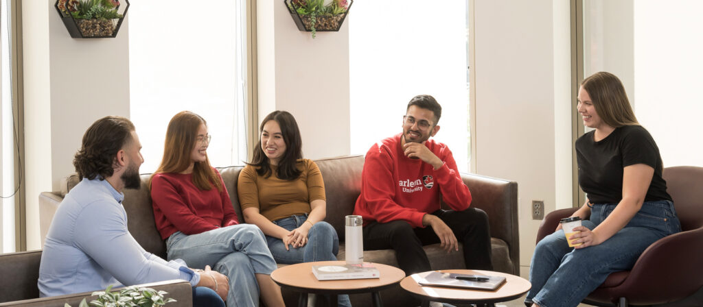 5 sprott students having a conversation in the UG lounge