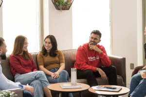 5 sprott students having a conversation in the UG lounge