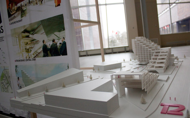 Pictured is one of the models from the gallery. The model is all white and the main building is shaped like a staircase.