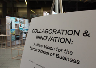 Pictured is a sign for the public gallery that says "Collaboration and Innovation: A New Vision for the Sprott School of Business"