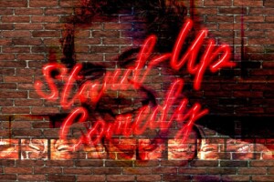 Handwriting script in neon lights against a brick wall saying 