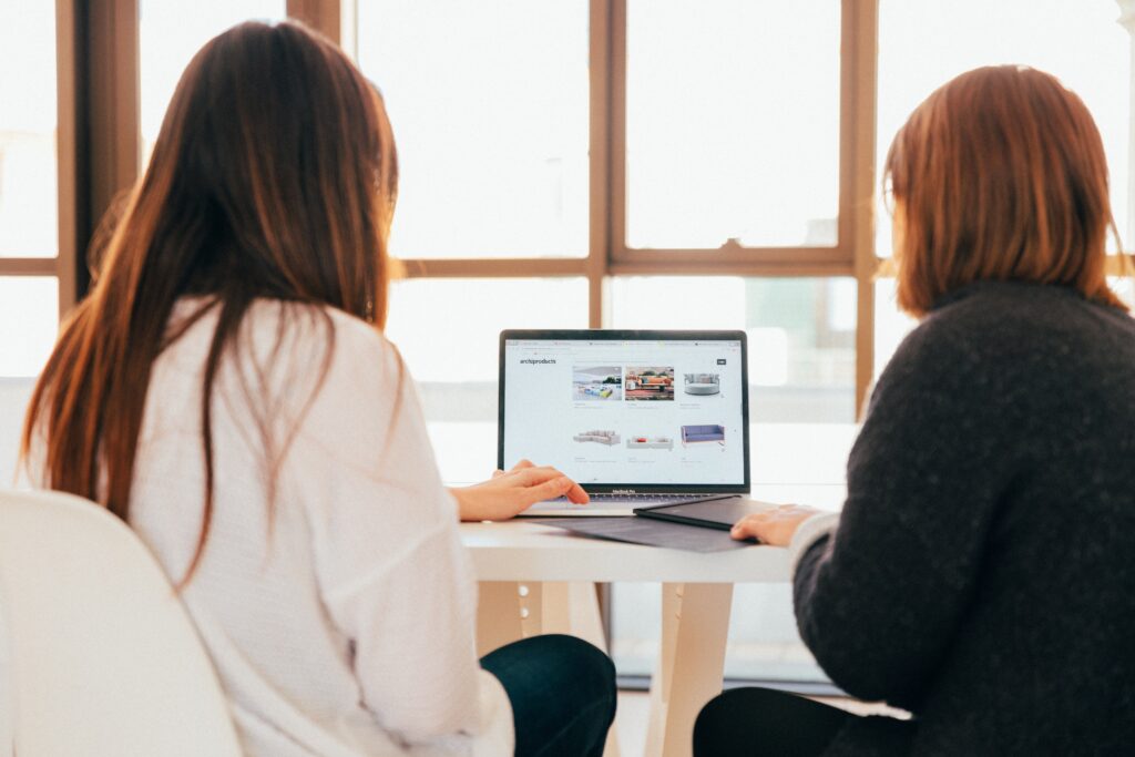 2 women working at a computer